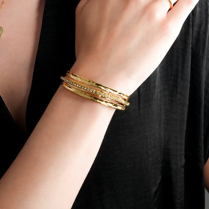 BELLINA Gold: Triple Stacked Textured Bracelet Zirconia (CZ) Embedded Tennis Bracelet at Centre. Stacked for Glamour.