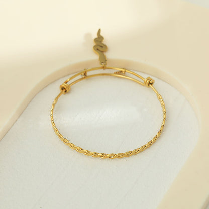 CATALINA Gold: Bracelet with Serpent, Sun Symbol and Zirconia (CZ) Charms