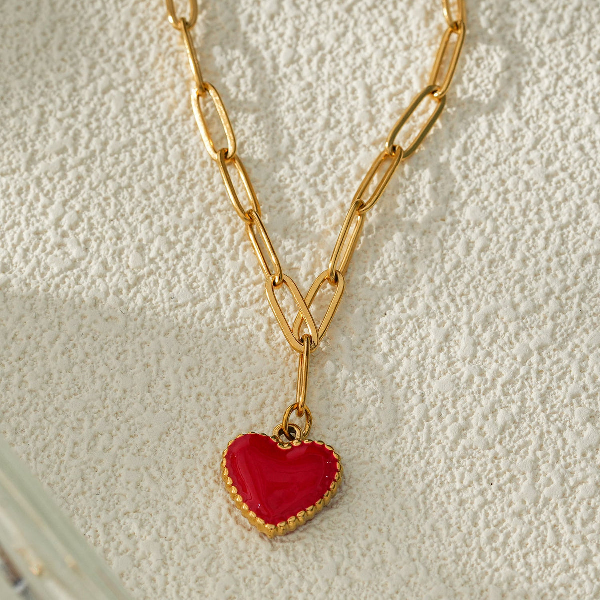 HEART ROUGE Gold: Paper Clip Chain Anchoring an Enameled Red Heart Charm