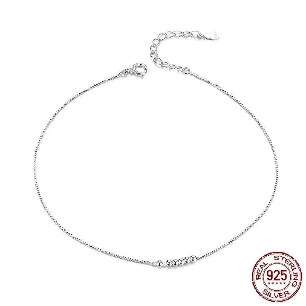 La délicate chaîne de cheville en argent sterling 925 avec perles