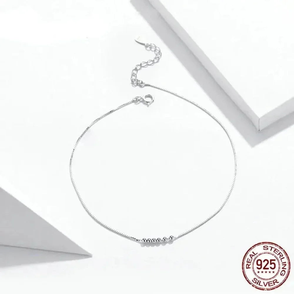 La délicate chaîne de cheville en argent sterling 925 avec perles