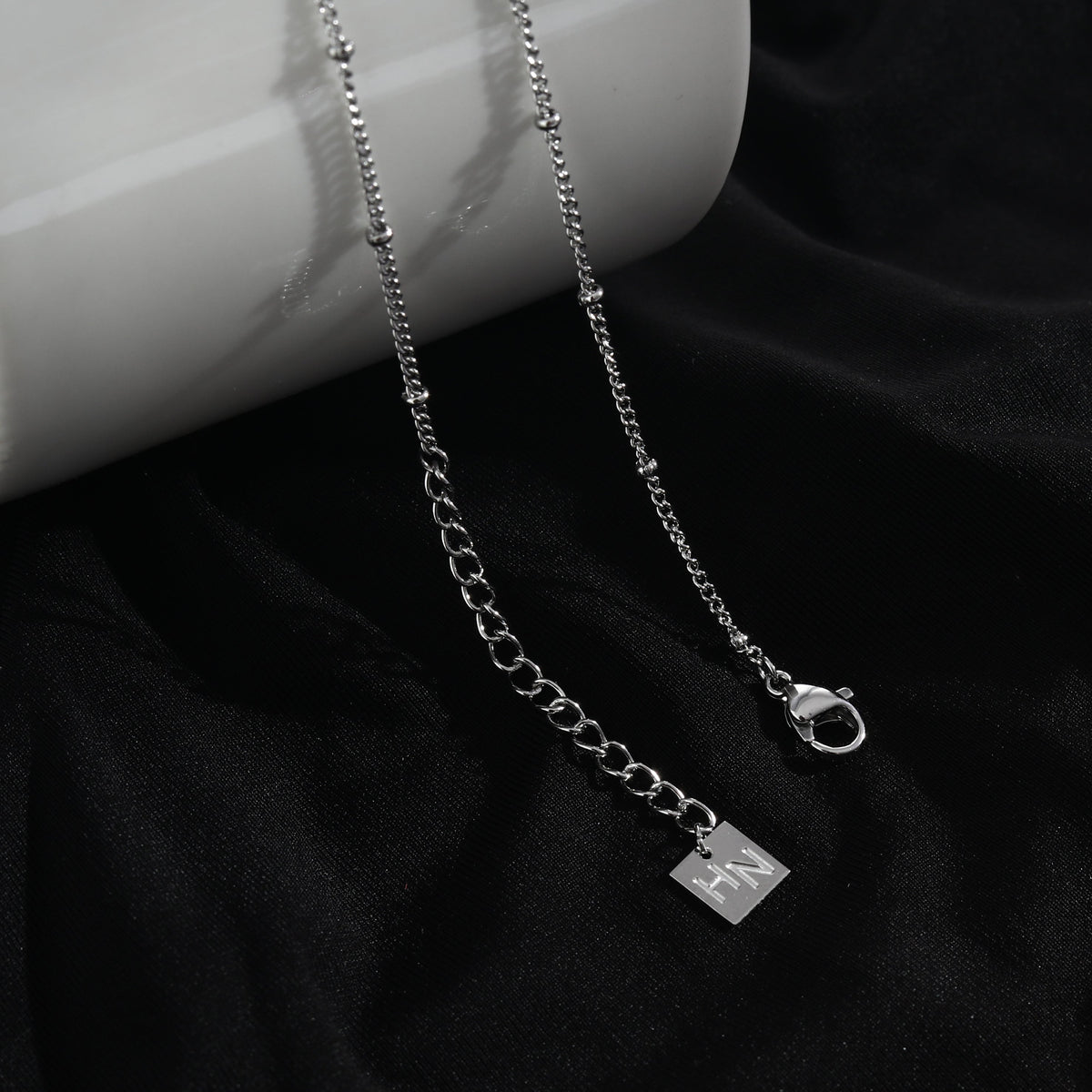 LERATI Beaded Chain with an Encased Fresh Water Pearl Pendant in Silver