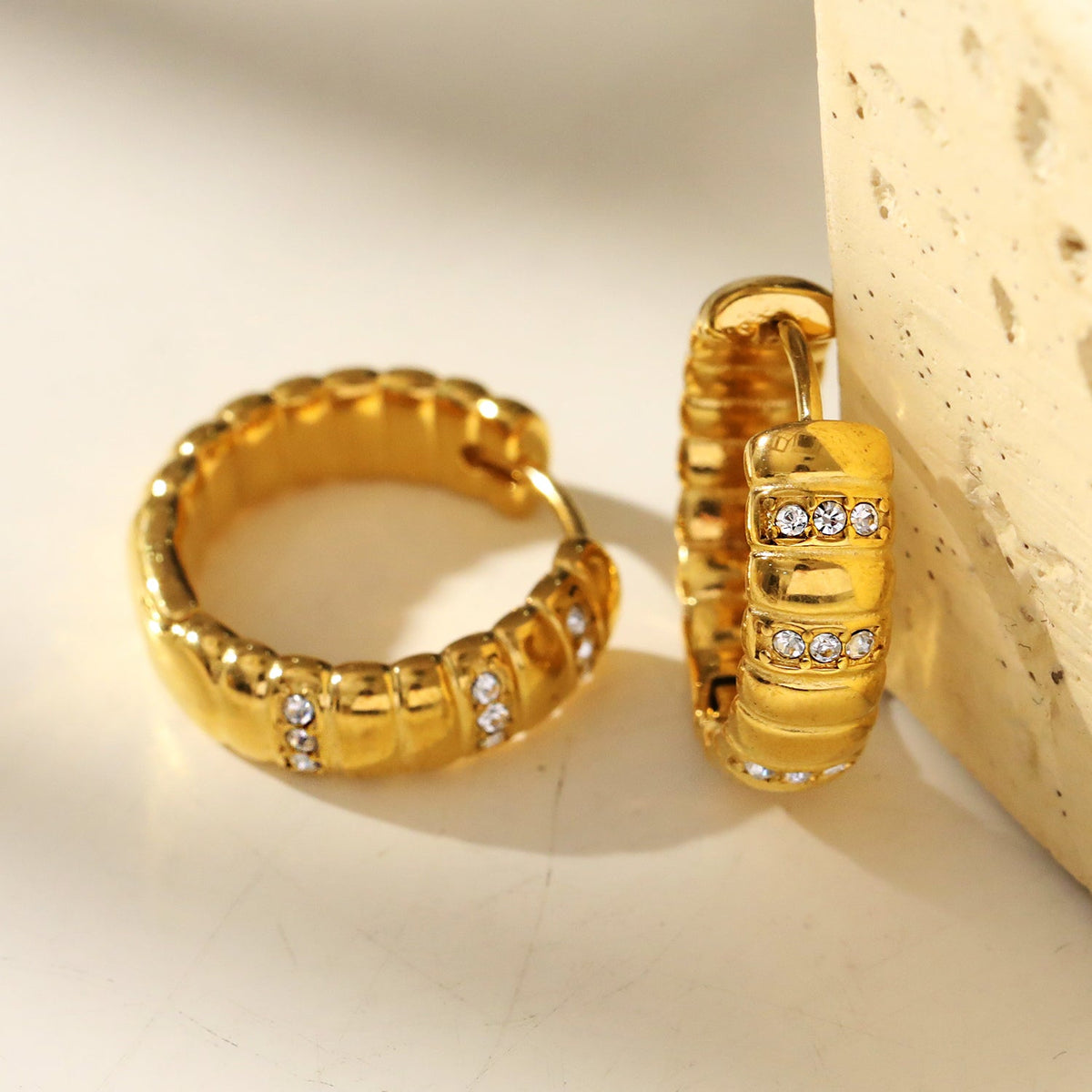 LIZBETH: Sculpted Hoop Earrings with Zirconia Embellishments.