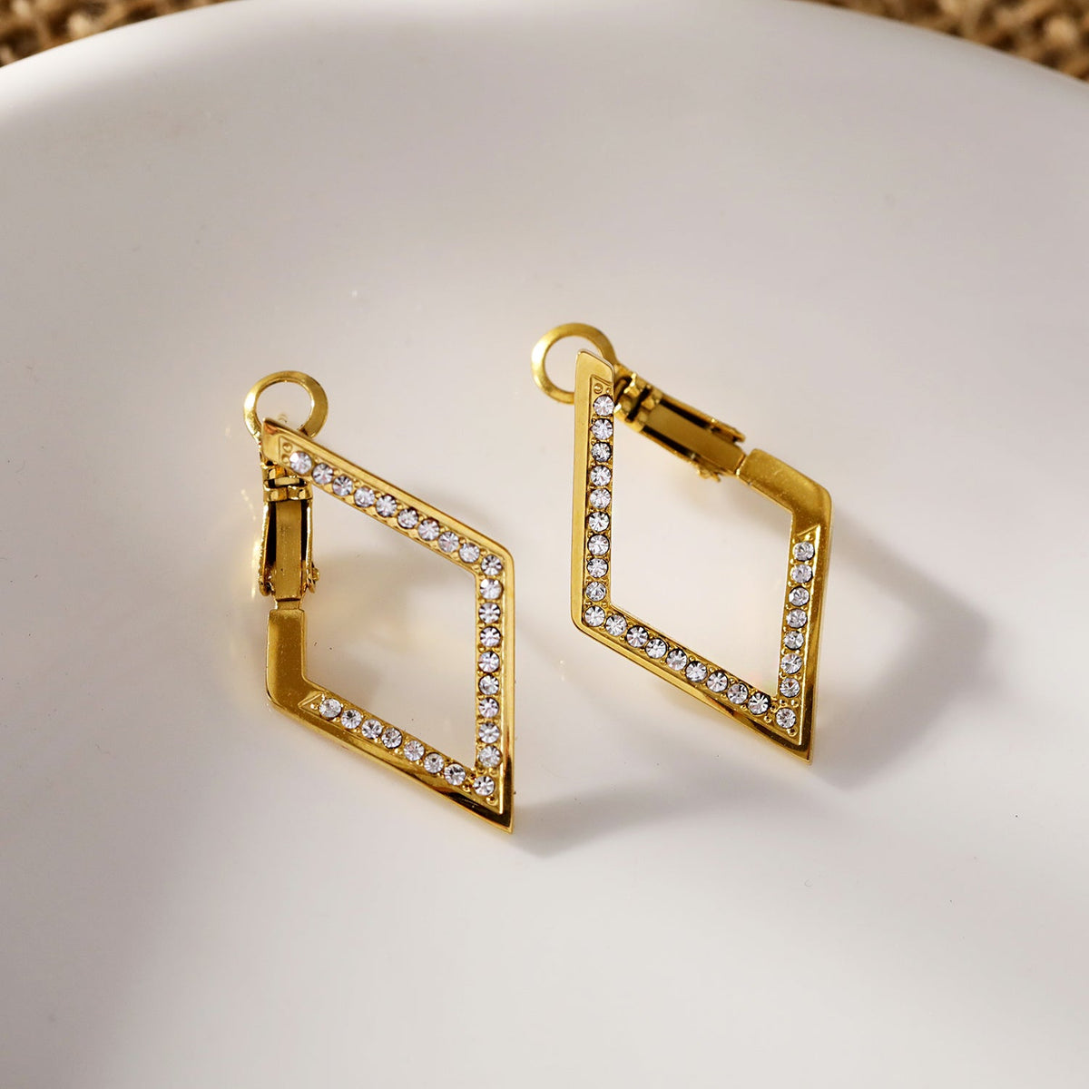 ALMA: Twisted Diamond Shaped Hoop Earrings Embedded with Zirconia Gemstones